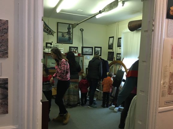 Families look in the shipping room for a hidden easter egg